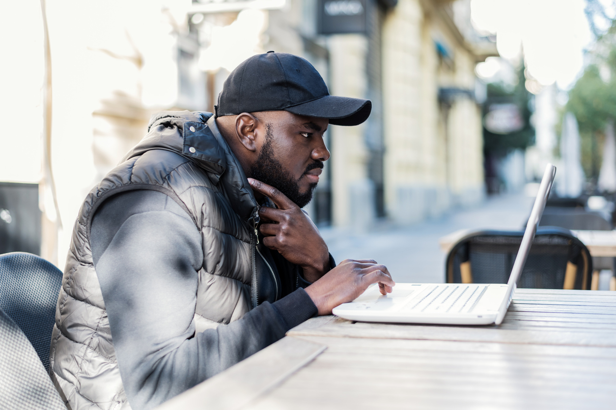 Person sitting in front of laptop | VIP Marketing and Advertising